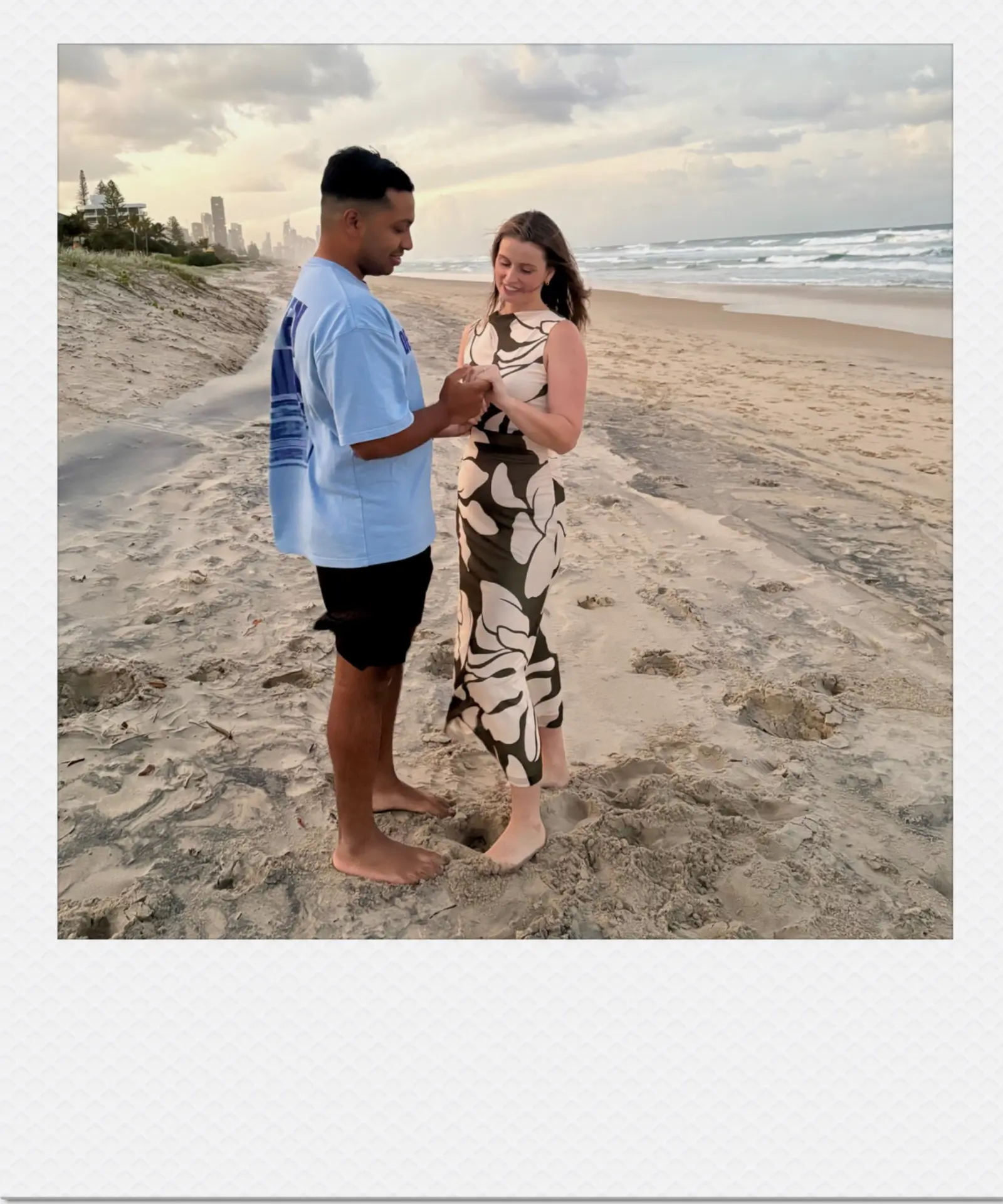 Nihal proposing to Hannah on a Gold Coast beach at sunset
